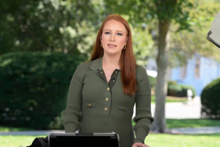 a woman speaks on a podium