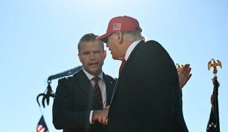 Donald Trump (right) shakes hands with Peter Hegseth