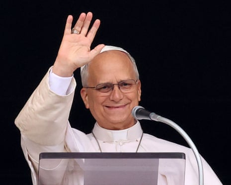 Pope Leo waving to a crowd in St Peter's Square from his Vatican window.