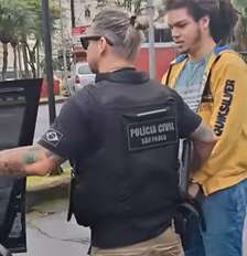Enzo Ricardo Verzani foi preso em flagrante nesta quarta-feira, 7, durante o cumprimento de um mandado de busca e apreensão em Santos (SP) Foto: Reprodução/Balanço Geral/Record